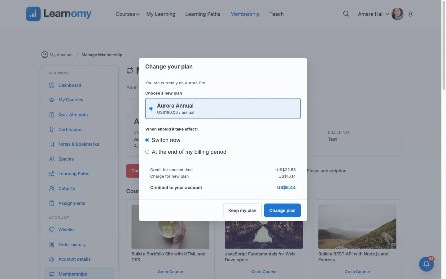 Change plan dialog showing a live proration quote: credit for unused time, charge for the new plan, and the net amount