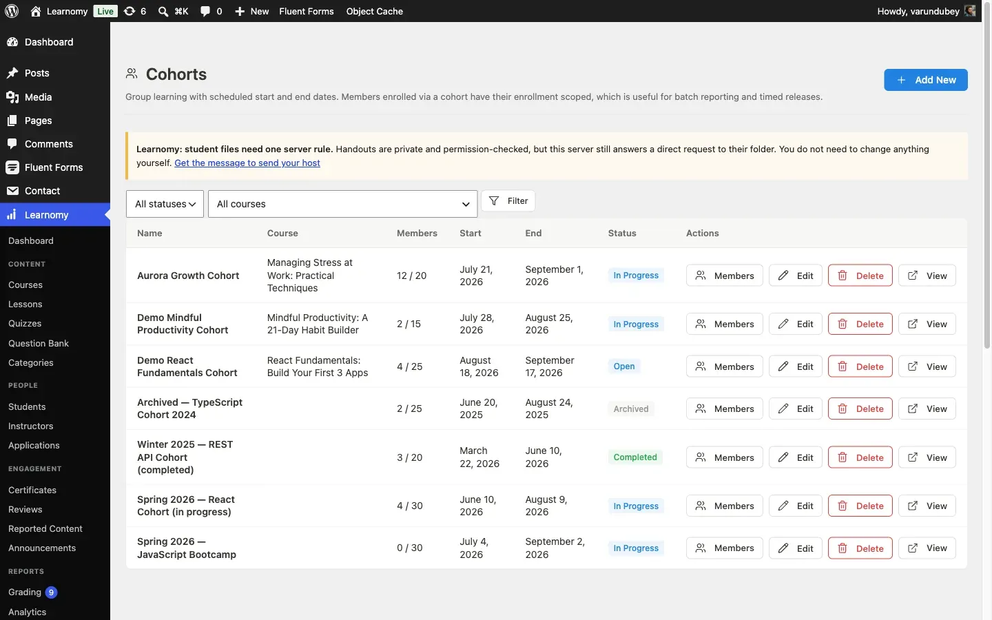 Cohorts list showing several batches at different statuses: In Progress, Open, Archived, and Completed