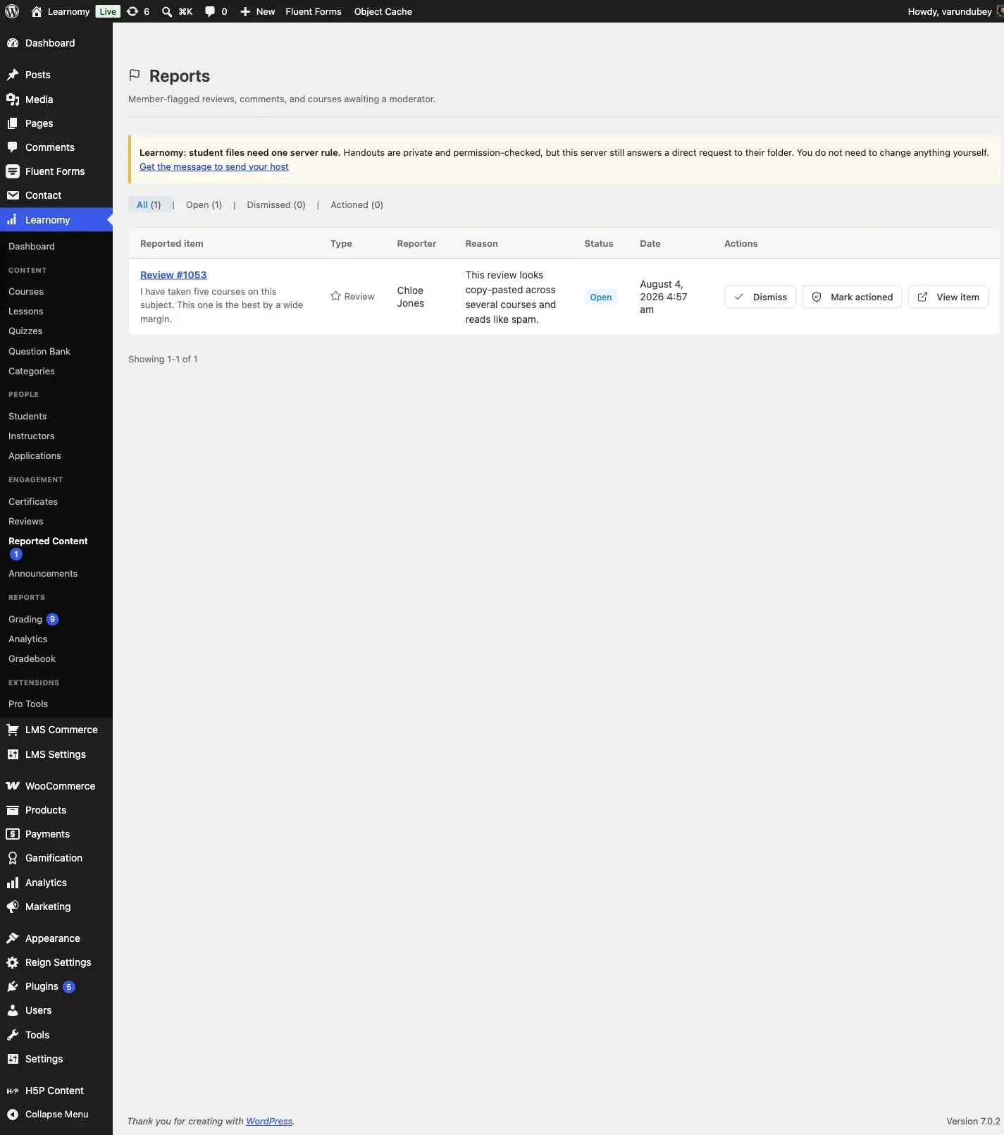 Reported Content queue with one open report against a course review