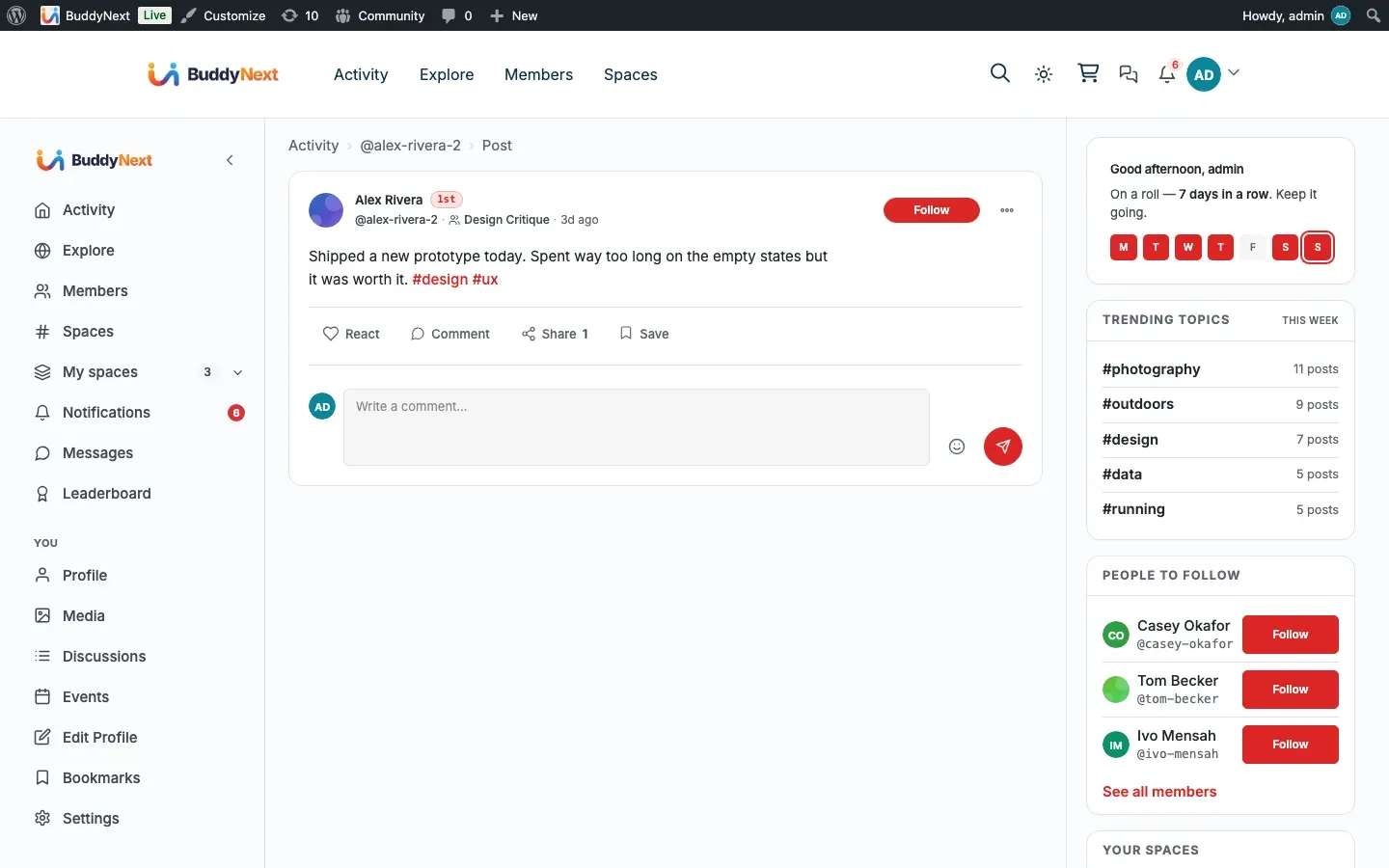 A BuddyNext post detail view with a threaded comment conversation underneath the post